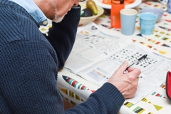 Image Person doing a difficult crossword