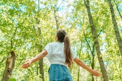 Image woman in forest breathes in
