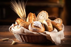 Image Bread and lots of fresh bread buns in a basket on a wooden table