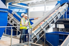 Image workers standing in PET recycling center