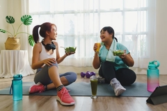 Image Two women drinking sucralose beverage after workout