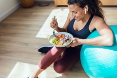 Image Healthy woman eating a salad