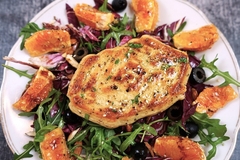 a plate of plant based meat with oranges