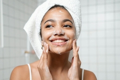 woman doing morning skin care routine