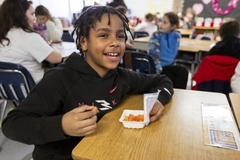Image child eating school lunch