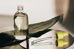 bottle of jojoba oil with pipette