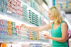 Image A consumer shopping for dairy.