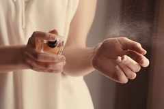 Image woman using perfume on her wrist