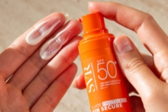 suncream on hand