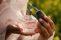 woman holding perfume bottle in china