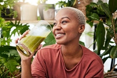 Image Healthy woman drinking green drink