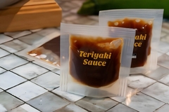 Image A close-up of a bag of sauce.