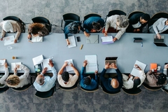 Researchers in a large meeting
