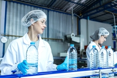 Image Women manufacturing PET bottles.