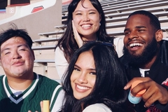 A group of college kids smiling.