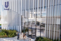 Image A rendering of people standing outside a Unilever building.