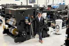 Image A man in front of a machine.
