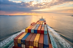 Ship on the ocean carrying cargo.