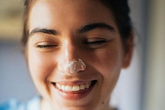Image woman with cream on her nose