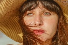 woman looking into sun