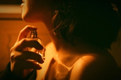 Image woman using perfume exploring senses