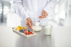 Image Hands on yogurt with background