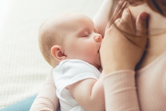 Image Woman breastfeeding baby