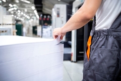 Image person gently stoking paper