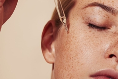 Image woman using serum for hydrating her skin