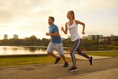Image Two active people running outside