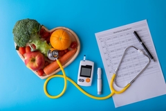 Image veggies on heart plate next to stethoscope