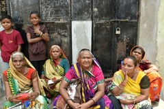 Image group of indian women sitting on doorstep