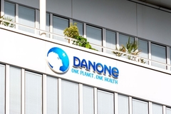 Image Danone logo on building.
