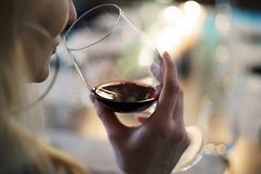 Image A woman having wine.