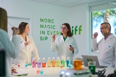 Image scientists in lab coats working with colorful oils in the lab