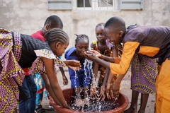 Image children in africa playing with clean water