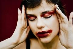 woman with smeared red makeup