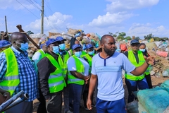Image Workers looking at waste