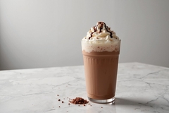Image Indulgent hot chocolate drink with cream.