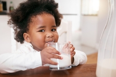 Image Healthy toddler drinking milk