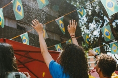 Image crows holding hands up at parade in brazil