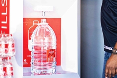 A water bottle with a refill machine