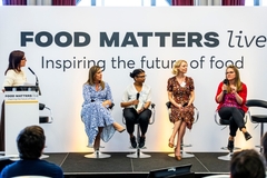 People on stage in a discussion at Food Matters Live.