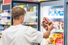 Image man looking at ice cream package