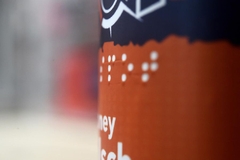 Image A bottle of beer with braille label on it
