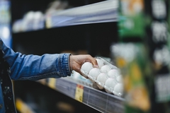 Image A shopper buying eggs.