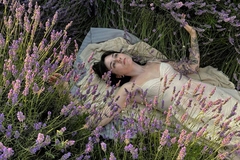 woman laying in field of lavender