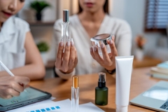 Image women holding personal care packaging
