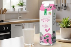 Image A carton of milk and a glass of milk