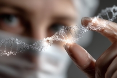 Image close up of scientist in protective gear holding up a DNA helix model
